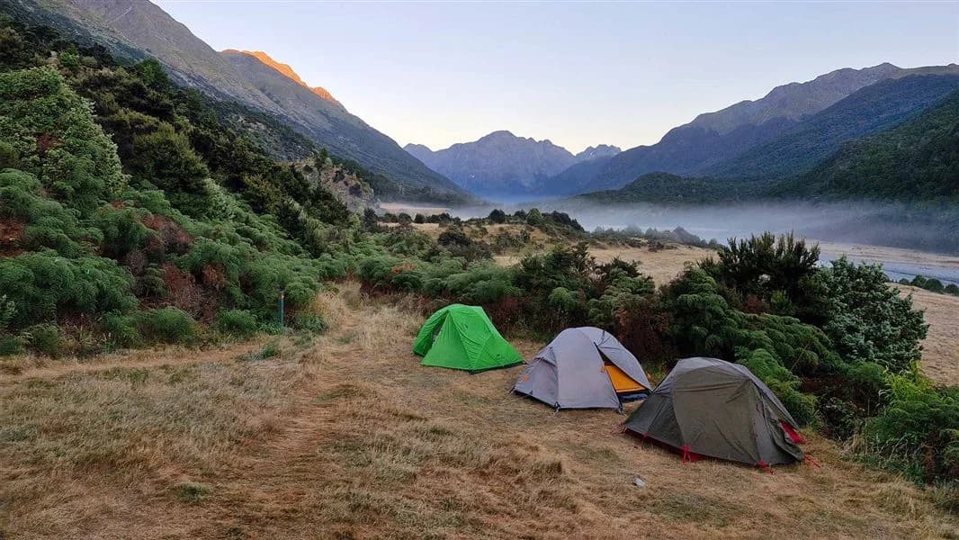 Three tents pitched at Mid Caples Campsite
