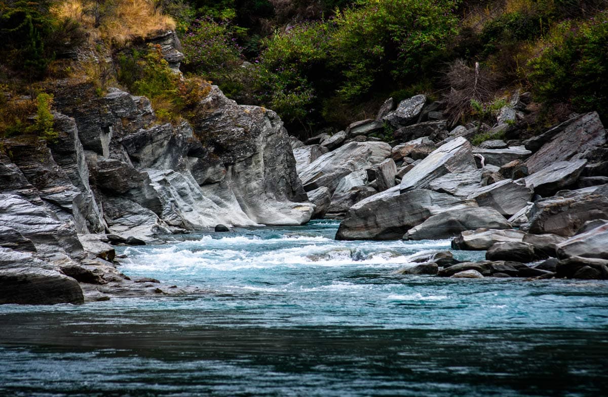 River flowing between rock walls.