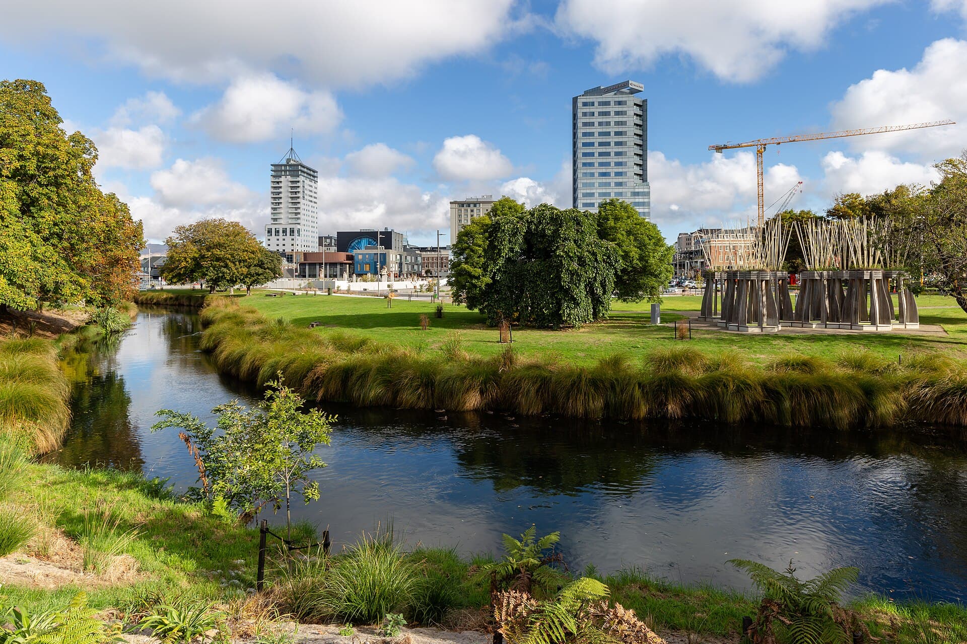 The Avon River beside lawns and central Christchurch buildings.