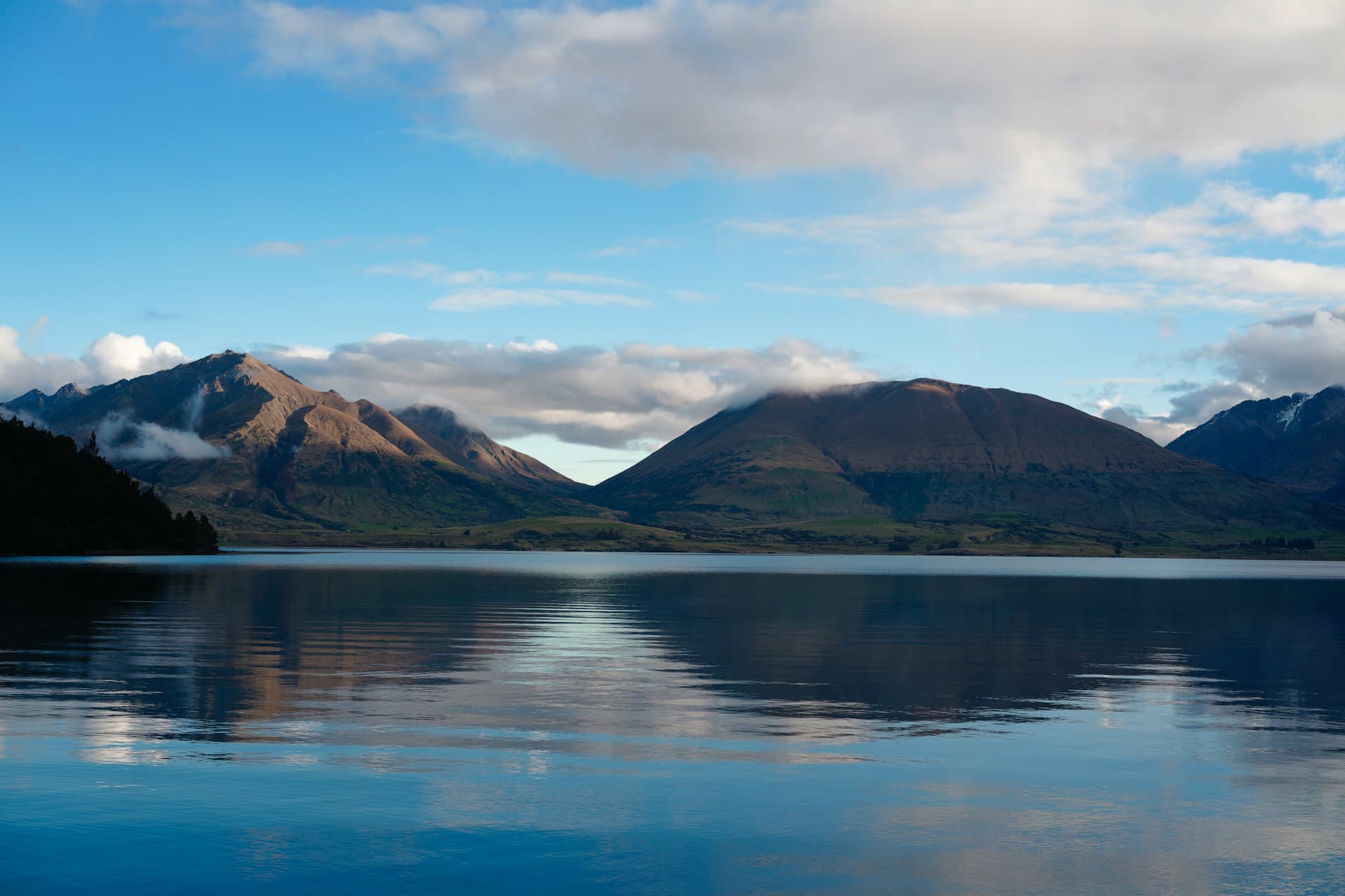 Clouds above mountains across Lake Wakatipu, seen from Bob's Cove Track.