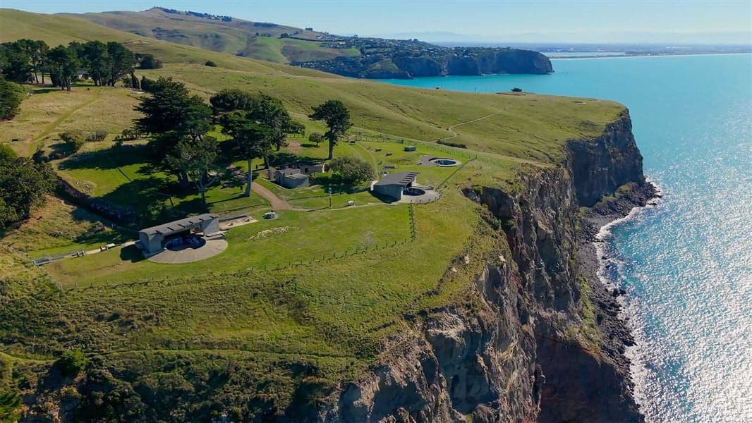 Historic gun emplacements on the grassy coastal cliffs at Godley Head near Christchurch.