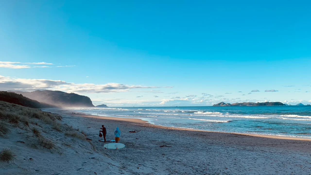 Opoutere Beach: Walkers at Opoutere Beach.