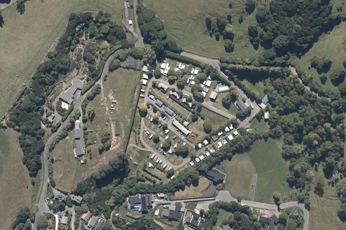 Aerial view of Akaroa TOP 10 Holiday Park and its immediate surroundings, from the 2025 LINZ imagery survey.