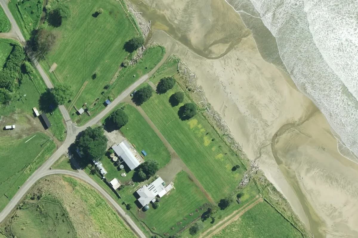 Aerial view of Anaura Bay Motor Camp and its immediate surroundings, from the 2024-2025 LINZ imagery survey.