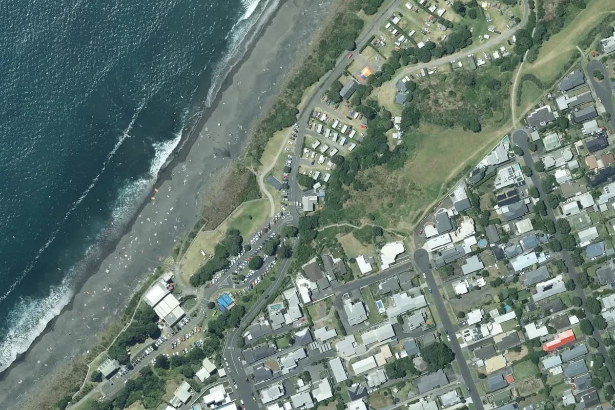 Aerial view of Fitzroy Beach Holiday Park and its immediate surroundings, from the 2022 LINZ imagery survey.