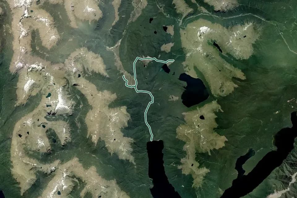 Historical aerial overview of the mapped Borland Road to Monowai Hut Track route, with an indicative DOC route overlay.