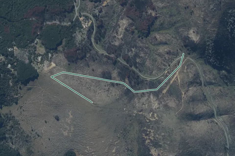 Historical aerial overview of the mapped Bridge Hill Track route, with an indicative DOC route overlay.