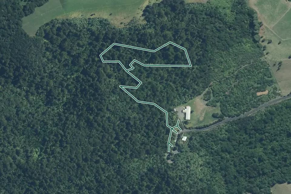 Historical aerial overview of the mapped Mangakara Nature Walk route, with an indicative DOC route overlay.