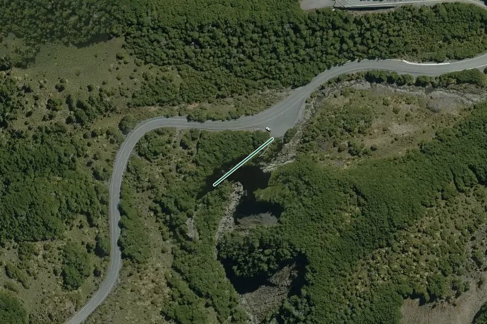 Historical aerial overview of the mapped Mangawhero Falls Walk route, with an indicative DOC route overlay.