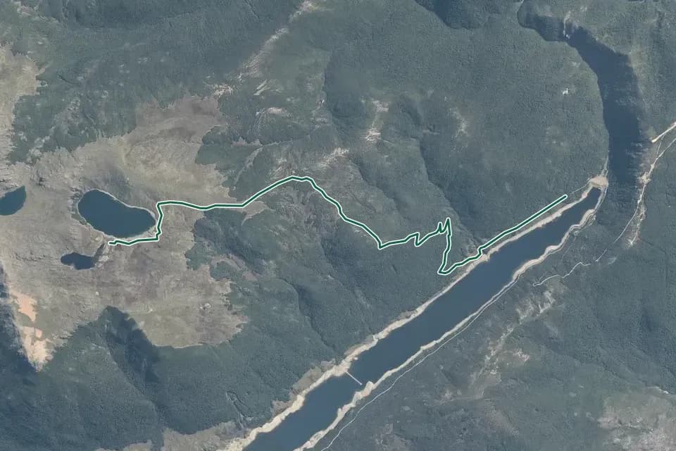 Historical aerial overview of the mapped Sylvester Hut Track route, with an indicative DOC route overlay.