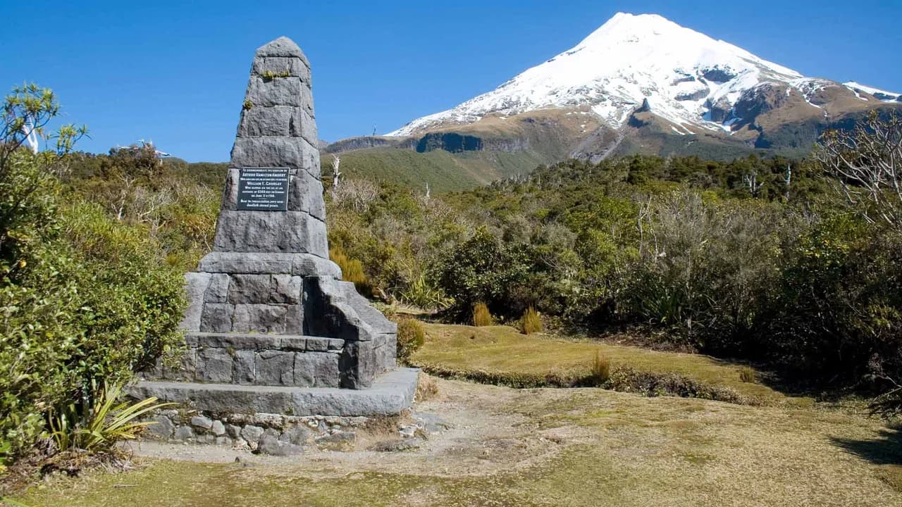 Ambury Monument, North Egmont: Stone monument with mountain in background.