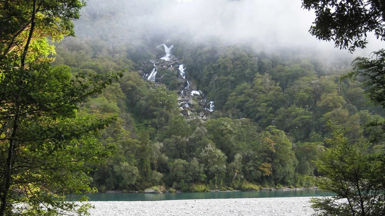 Roaring Billy Falls seen from across the Haast River: Roaring Billy Falls viewed across the Haast River.